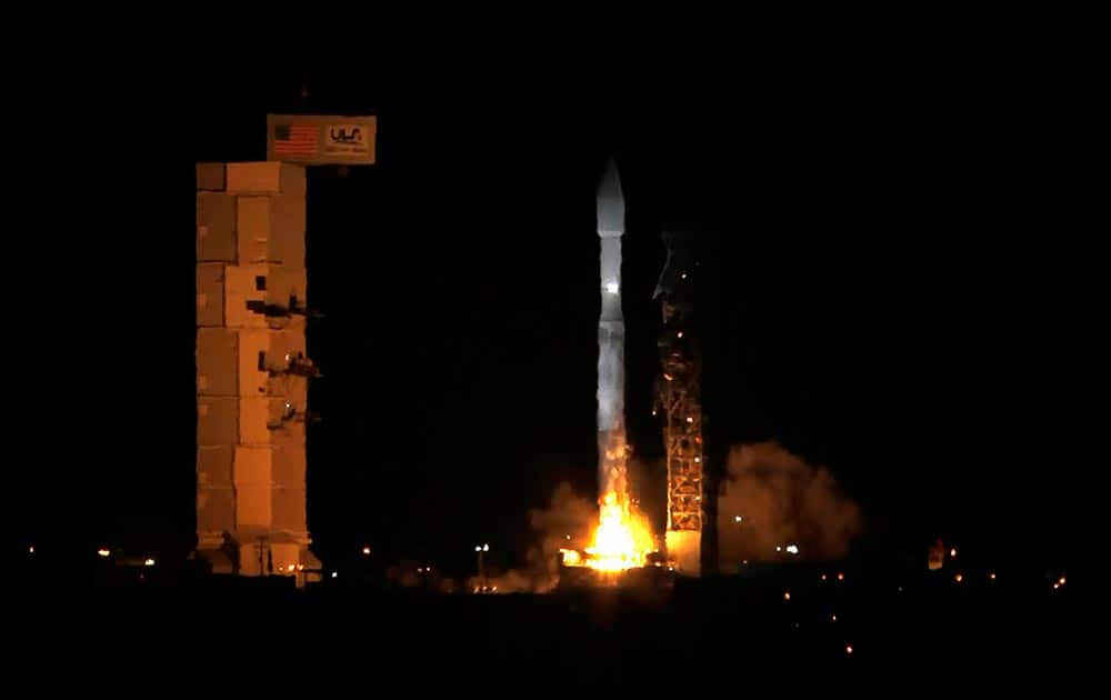 An Atlas V rocket carrying 13 CubeSats launches from Space Launch Complex-3 on Thursday, at Vandenberg Air Force Base, Calif. 