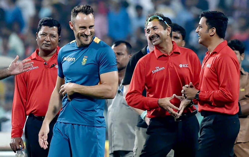 South African captain F du Plessis shares light moments with umpires during dround inspection for 3rd T20 Match at Eden Garden in Kolkata .