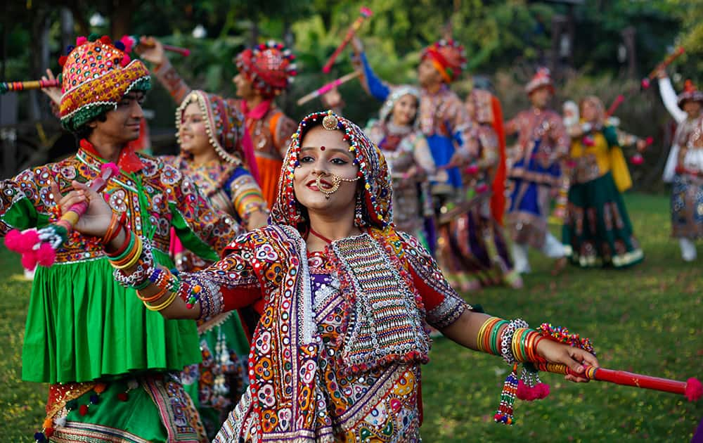 Indians wearing traditional attire practice Garba, the traditional dance of Gujarat state ahead of Hindu festival Navratri in Ahmedabad.