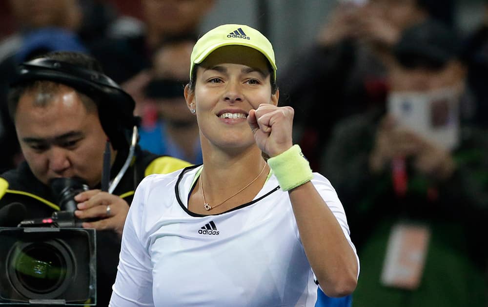 Ana Ivanovic of Serbia celebrates after defeating Anastasia Pavlyuchenkova of Russia in the women's singles quarterfinal match of the China Open tennis tournament at the National Tennis Stadium in Beijing.