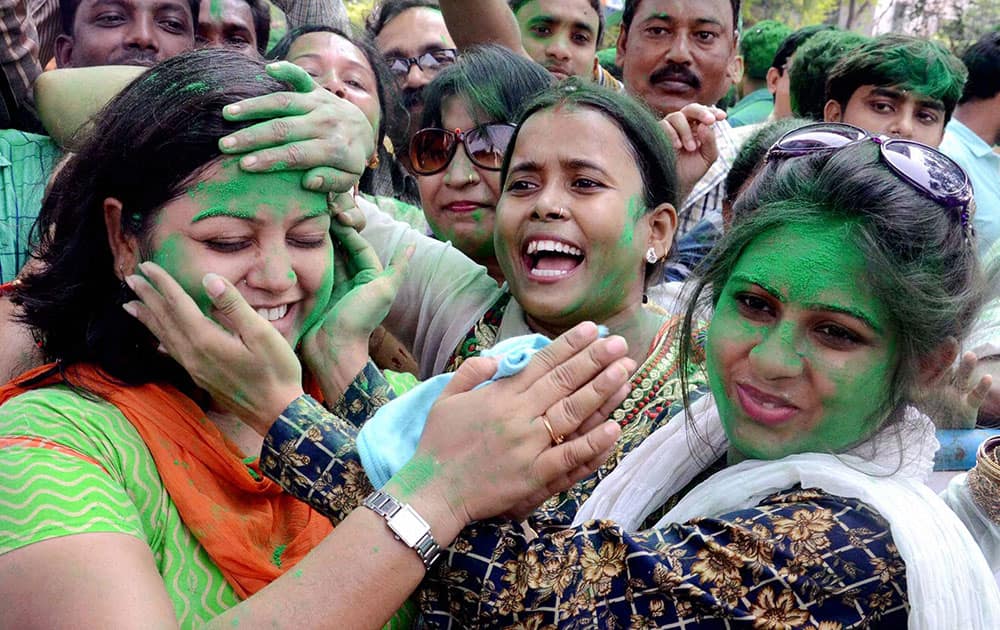 TMC supporters celebrate after their win in Bidhannagar Municipality election, at Salt Lake in North 24 Pargana district.