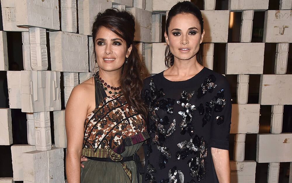 Salma Hayek, left, and Mia Maestro arrive at the 13th Annual Gala in the Garden at the Hammer Museum in Los Angeles. 