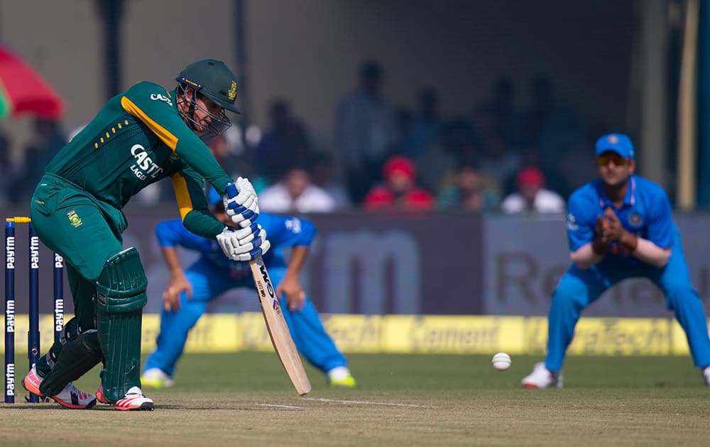 South African batsman Quinton de Kock hits a ball against India in the first of their five one-day match series in Kanpur, India.