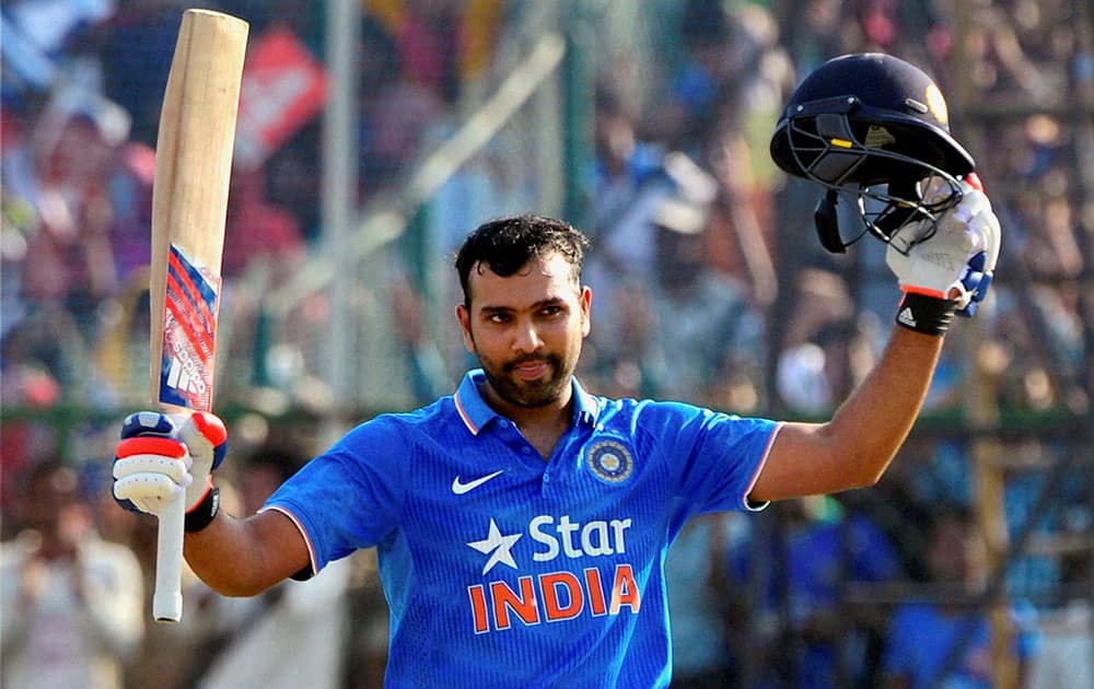 India’s Rohit Sharma acknowledges the crowd after scoring hundred runs during the first one day international cricket match against South Africa in Kanpur, India.