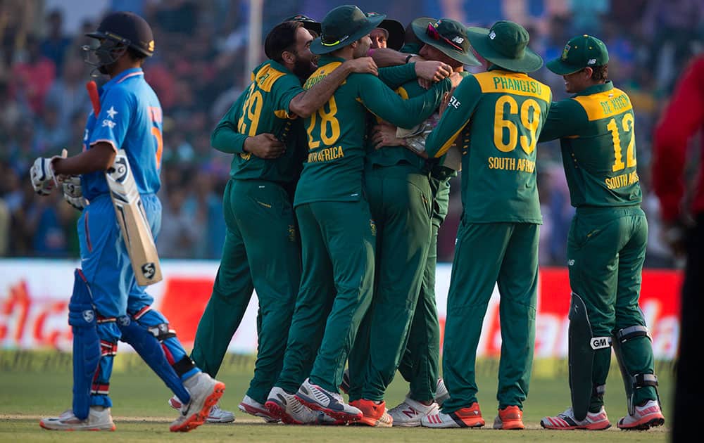 South Africa’s cricketer team members celebrate their victory over India during the first one day international cricket match between them in Kanpur, India.
