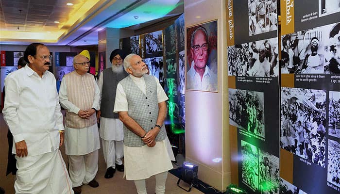 Prime Minister Narendra Modi with Union Minister Venkaiah Naidu and senior BJP leader LK Advani looks at the phonographs showcased in an exhibition during the Loktantra Prahari Abhinandan event on the occasion of the 113th birth anniversary celebration of the socialist leader Jayaprakash Narayan, in New Delhi.