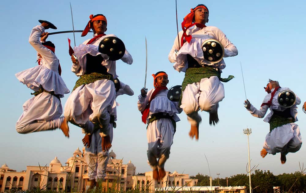 Folk dancers perform Dandiya, a traditional dance, during a rehearsal ahead of Navratri festival in Ahmedabad.