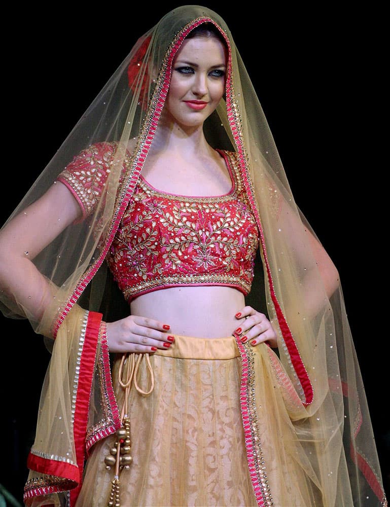 A model walks the ramp at a fashion show in Meerut.