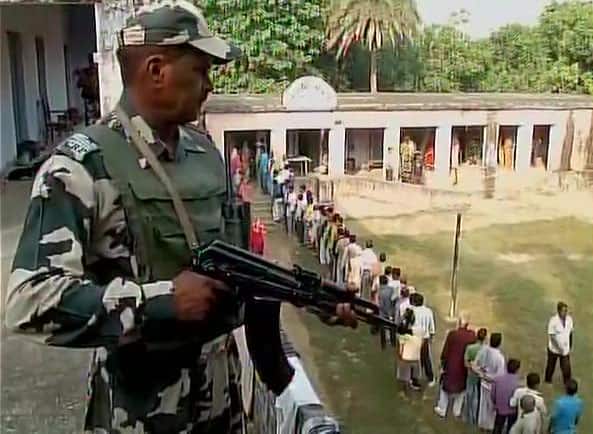 Lakhisarai: Voters stand in long queue outside a polling booth to cast their votes for first phase of #Biharpolls  -twitter@ANI_news