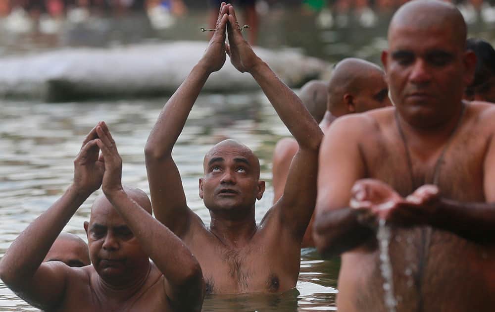 Hindu devotees perform rituals on the occasion of Mahalaya, or an auspicious day to pay homage to their ancestors, in Mumbai.