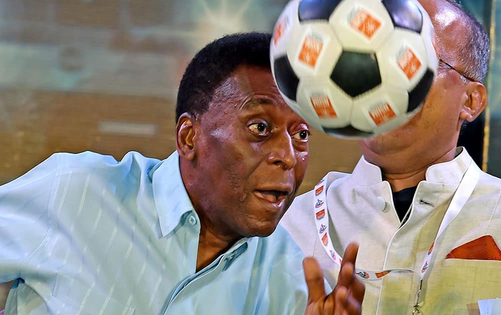 Legendary Brazilian footballer Pele showing his skill to the students during an interaction with them in Kolkata.
