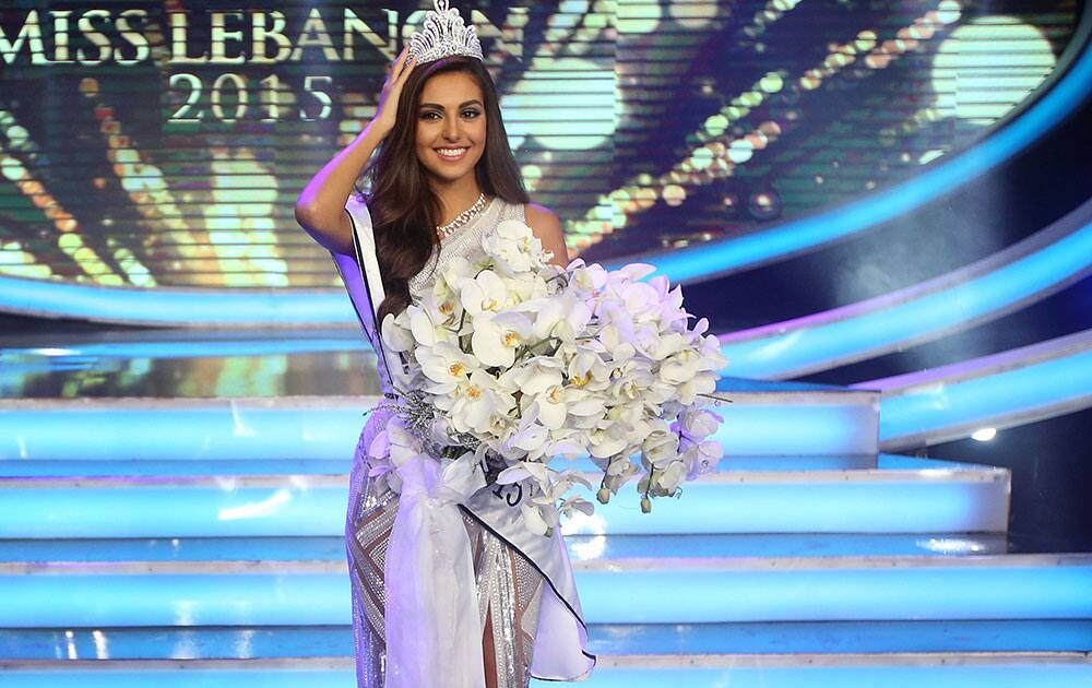 Lebanese Valerie Abou Shakra, 23, newly crowned Miss Lebanon 2015, fixes her crown after winning the Miss Lebanon 2015 contest, at Casino Du Liban, north of Beirut.