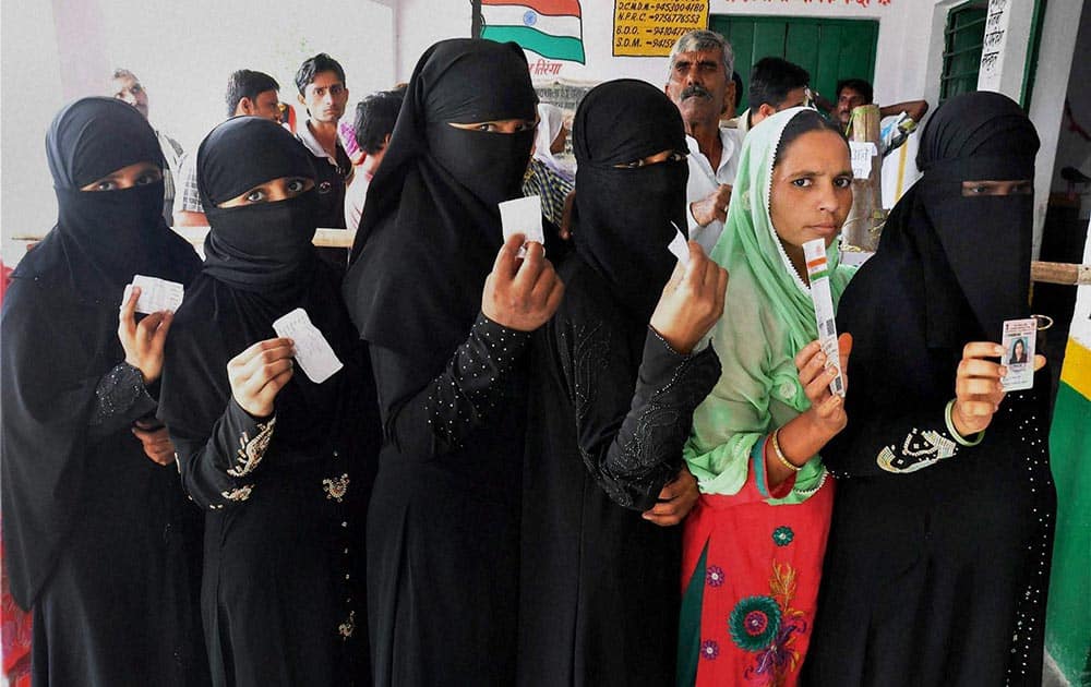 Voters waiting in queue to cast their vote during second phase of panchyat elections at Mathura in Uttar Pradesh.