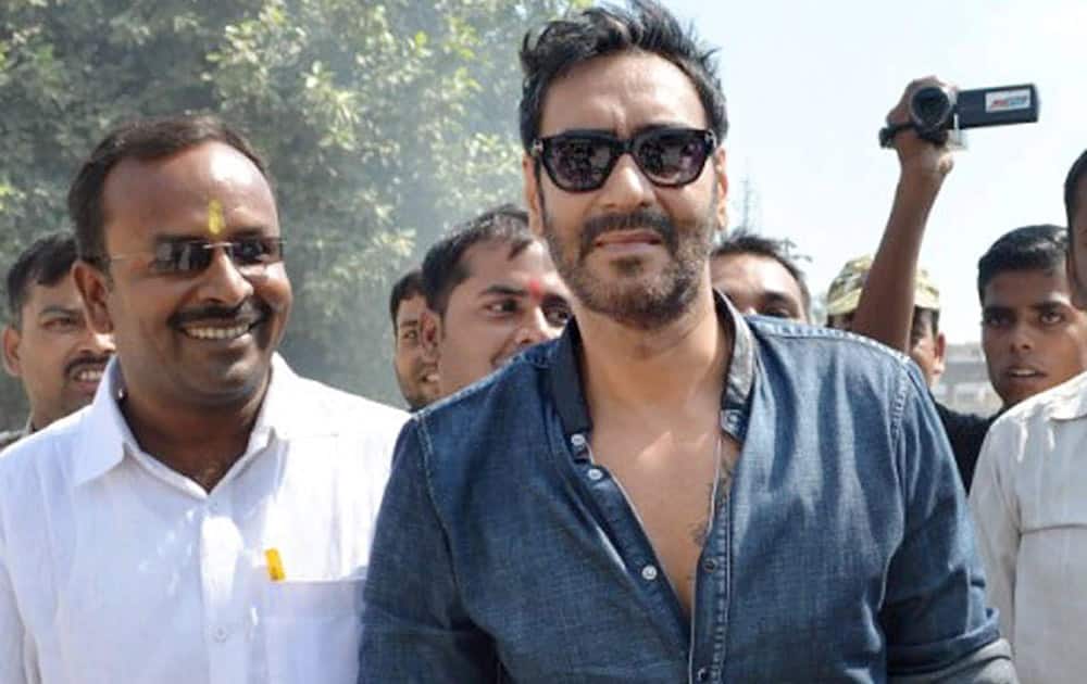 Bollywood actor star Ajay Devgn leaves as crowd grew restive due to his late arrival at a poll rally in Bihar Sharif.