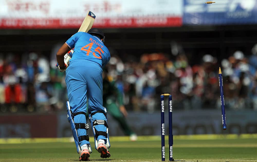 Rohit sharma is bowled out during their second one-day international cricket match against South Africa in Indore.