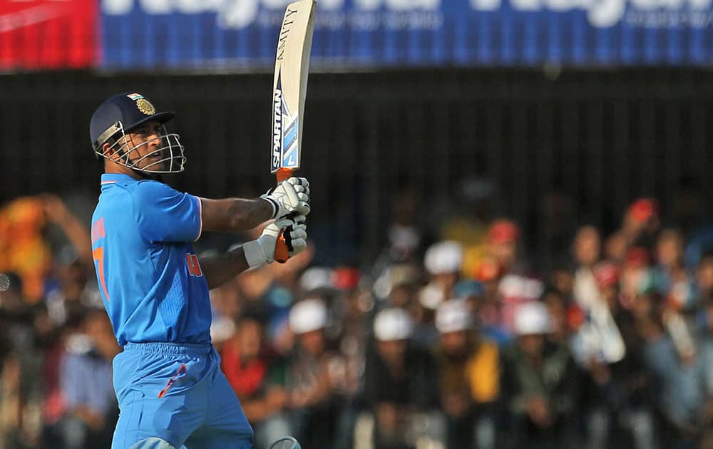 MS Dhoni plays a shot during their second one day international cricket match against South Africa in Indore.
