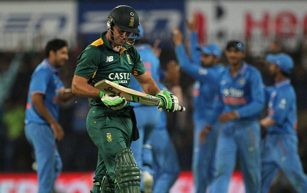 South Africa's AB de Villiers leaves the field after he was caught out for 19 runs while batting against India during their second one day international cricket match in Indore.