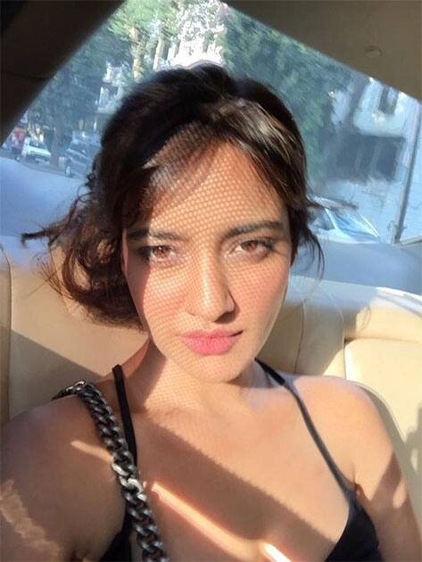 Soaking some sun between meetings...#Mumbai Twitter@Officialneha