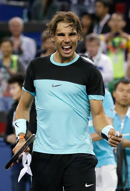 Rafael Nadal of Spain celebrates after winning his third round of the Shanghai Masters tennis tournament against Milos Raonic of Canada in Shanghai, China.