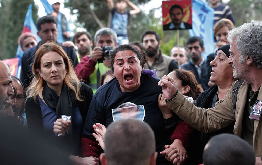 A relative of Serdar Ben, 33, one of the victims of Oct. 10 bombings in Ankara, bursts into tears during his funeral in Istanbul.