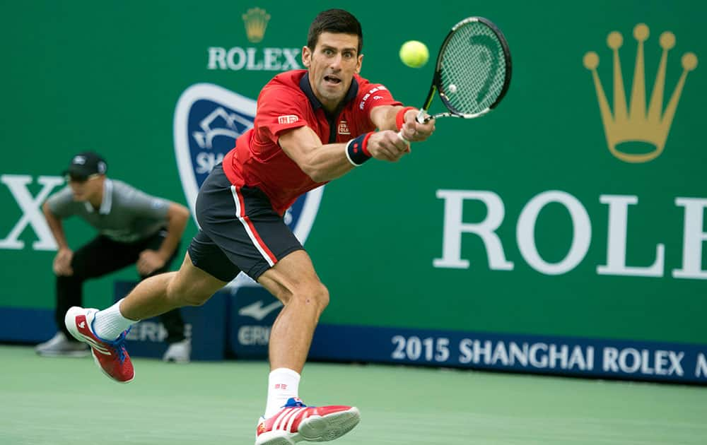 Novak Djokovic of Serbia reaches for the ball as he plays against Feliciano Lopez of Spain during their Shanghai Masters tennis tournament in Shanghai, China.