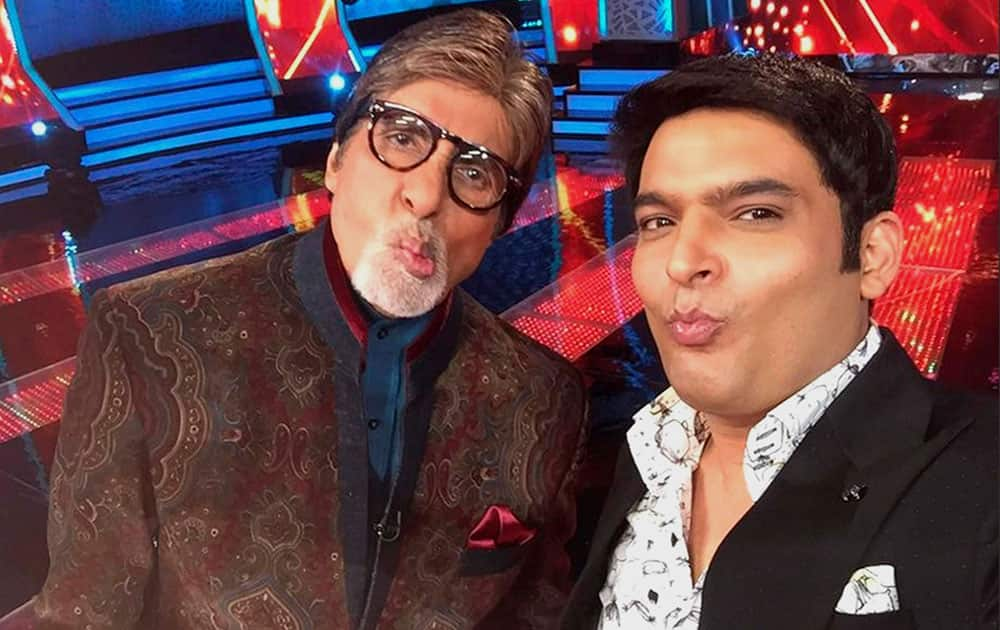 Bollywood actor Amitabh Bachchan with comedian Kapil Sharma on the sets of an upcoming TV show in Mumbai.