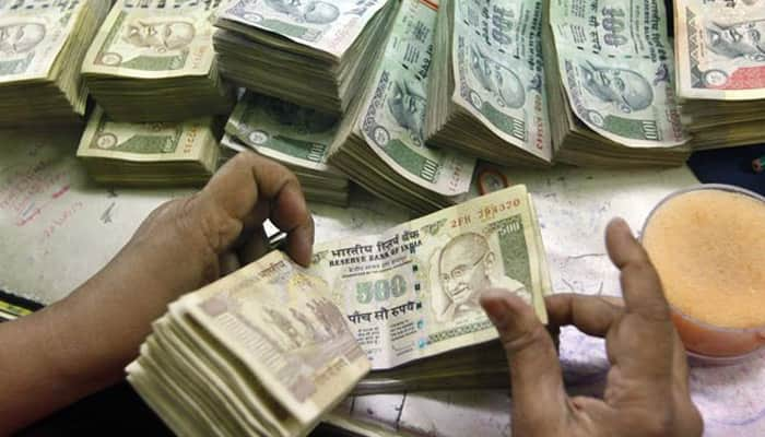 Rupee down 13 paise on strong dollar demand