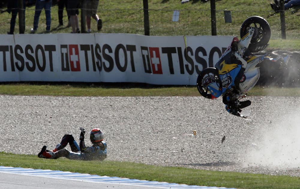 Moto2 rider Tito Rabat of Spain crashes on the exit to turn 11 during free practice two for the Australian Motorcycle Grand Prix at Phillip Island, Australia.