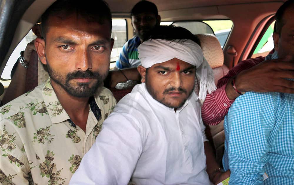 Patidar Anamat Andolan Samiti Conveyor Hardik Patel arrested by police on his way to protest in Cricket match from Rajkot Jamnagar Highway near Rajkot.