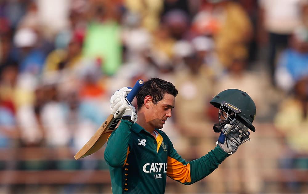 South Africa's Quinton de Kock, celebrates scoring his hundred runs during their third one-day international cricket match against India in Rajkot.