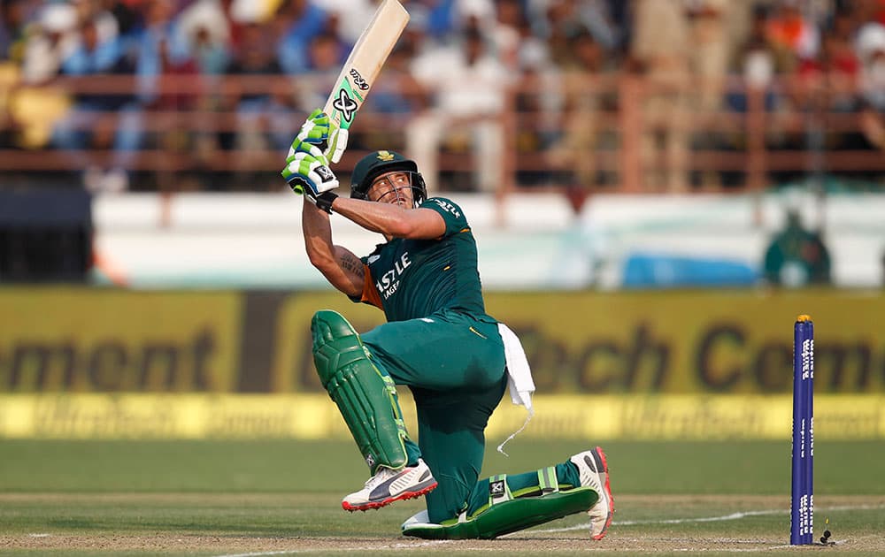 South Africa's Faf du Plessis, plays a shot during their third one-day international cricket match against India in Rajkot.