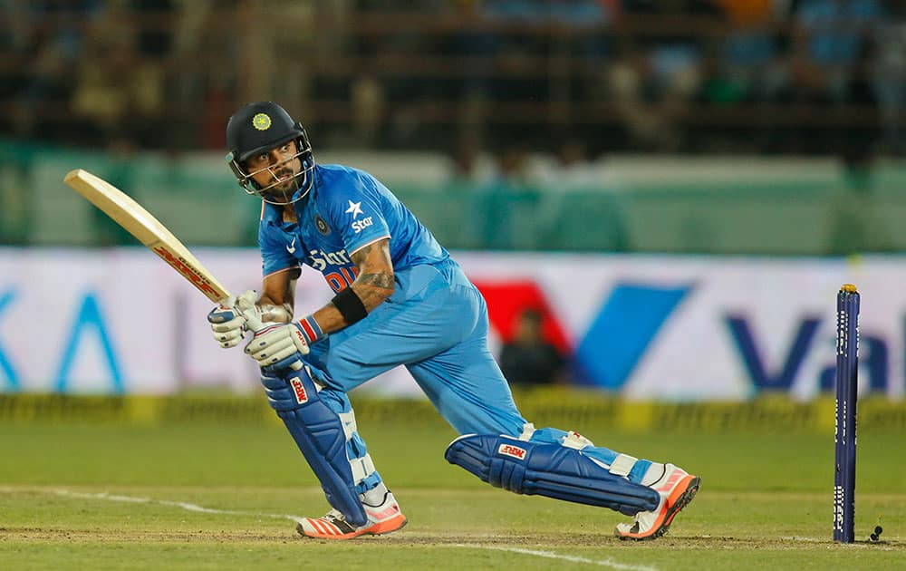 Virat Kohli watches his shot during their third one-day international cricket match against South Africa in Rajkot.