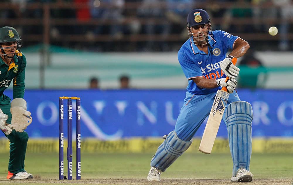 Mahendra Singh Dhoni bats during their third one-day international cricket match against South Africa in Rajkot.