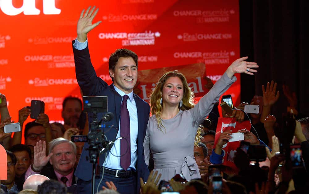 Liberal leader Justin Trudeau waves with his wife Sophie Gregoire at the Liberal party headquarters in Montreal. Trudeau, the son of late Prime Minister Pierre Trudeau, became Canada’s new prime minister after beating Conservative Stephen Harper. 