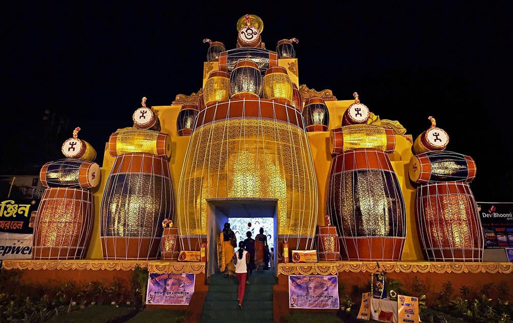 A community Durga Puja pandal built with drums in Kolkata.