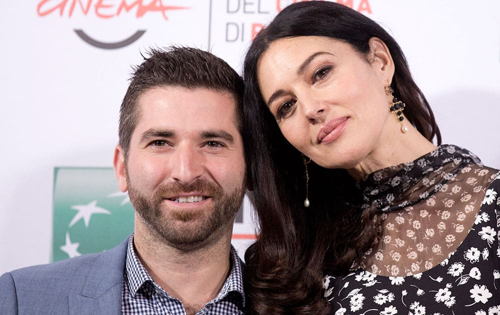 Actress Monica Bellucci and director Guy Edoin pose for photographers during the photo call of the movie Ville-Marie at the Rome's Film Festival in Rome.