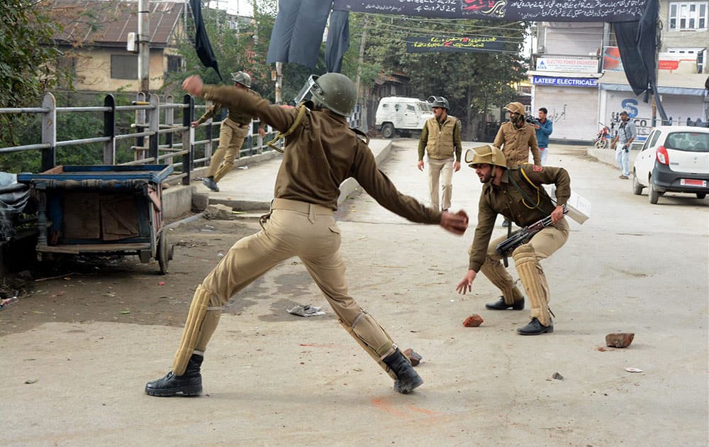 Security personnel in action to disperse JKLF supporters protesting against the arrest of their Chairman Yasin Malik in Anantang, at Business hub Lal Chowk in Srinagar.