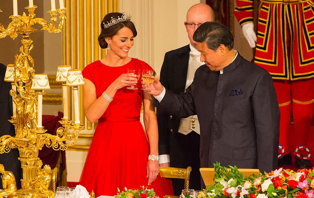 The Duchess of Cambridge and Chinese President Xi Jinping at a state banquet in the Ballroom at Buckingham Palace, London, on the first day of the state visit to the Britain.