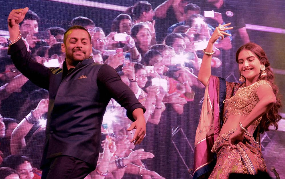 Actors Salman Khan with Sonam Kapoor at a Navratri festival in Ahmedabad.