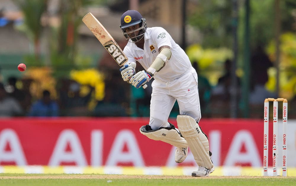 Sri Lankan cricketer Angelo Mathews follows the ball after playing a shot during the first day of their second test cricket match with West Indies in Colombo, Sri Lanka.