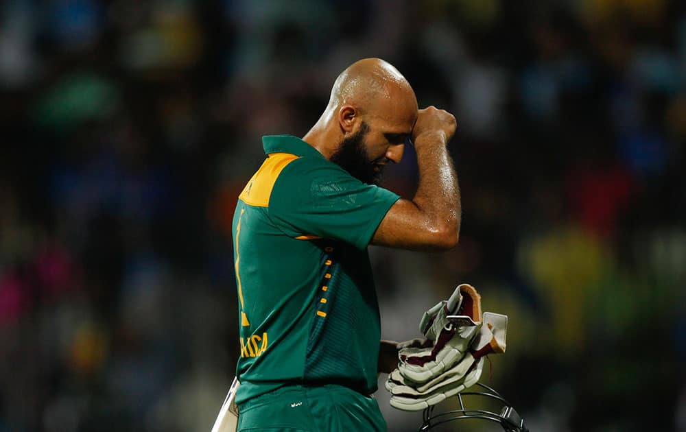 South Africa's Hashim Amla gestures as he walks back after his dismissal during their fourth one-day international cricket match against India in Chennai.
