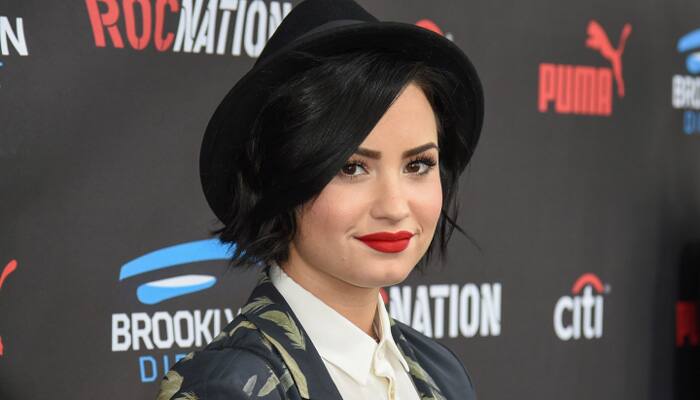 Lovato replaces tour opener Adam Lambert with Nick Jonas