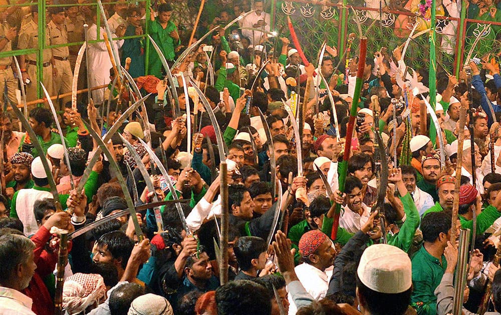 Muslims display their skills with swords during a Muharram procession in Ajmer, Rajasthan.
