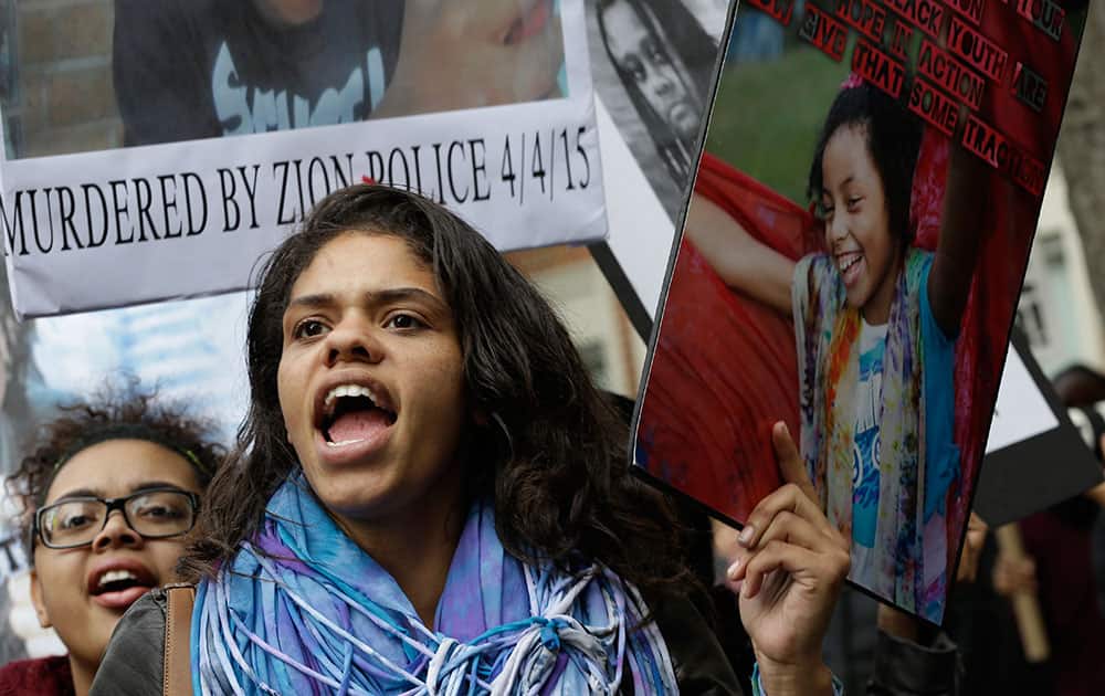 Demonstrators chant slogans during a rally to protest against police brutality in New York. Speakers at the protest said they want to bring justice for those who were killed by police.