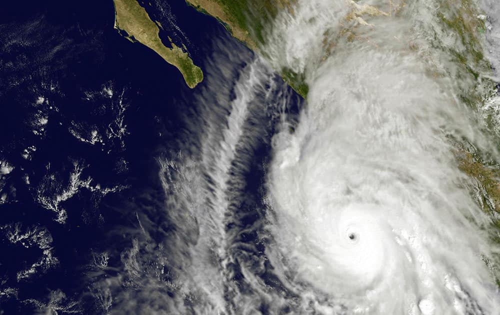 This satellite image taken at 1:45 p.m. EDT on Friday, Oct. 23, 2015, and released by NASA, shows the eastern quadrant and pinhole eye of Hurricane Patricia moving towards southwestern Mexico. The Category 5 storm is strongest ever in the Western Hemisphere, according to forecasters.