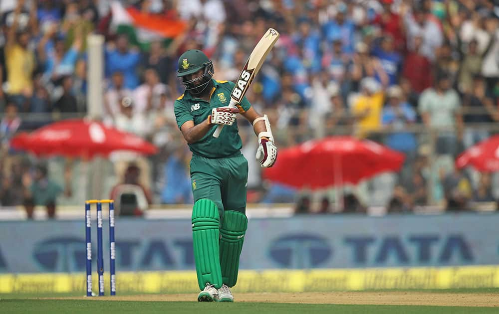 South Africa’s Hashim Amla reacts after his dismissal during the final one-day international cricket match of a five-game series against India in Mumbai, India.