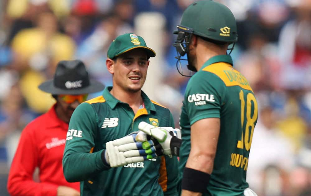 South Africa’s Quinton de Kock, left, celebrates his fifty runs with Faf du Plessis during the final one-day international cricket match of a five-game series against India in Mumbai, India.