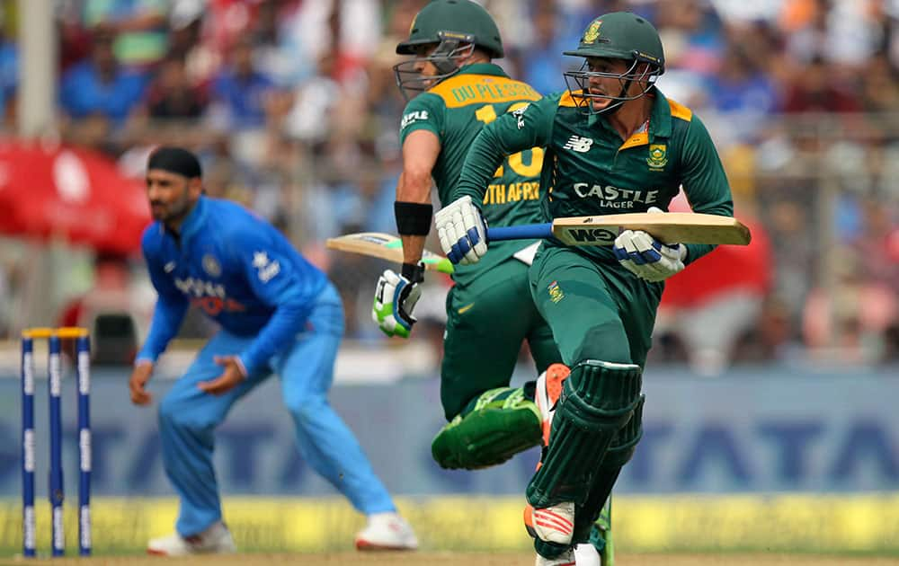 South Africa’s Quinton de Kock, right and Faf du Plessis run between wickets as India's Harbhajan Singh waits for the ball during the final one-day international cricket match of a five-game series in Mumbai, India.