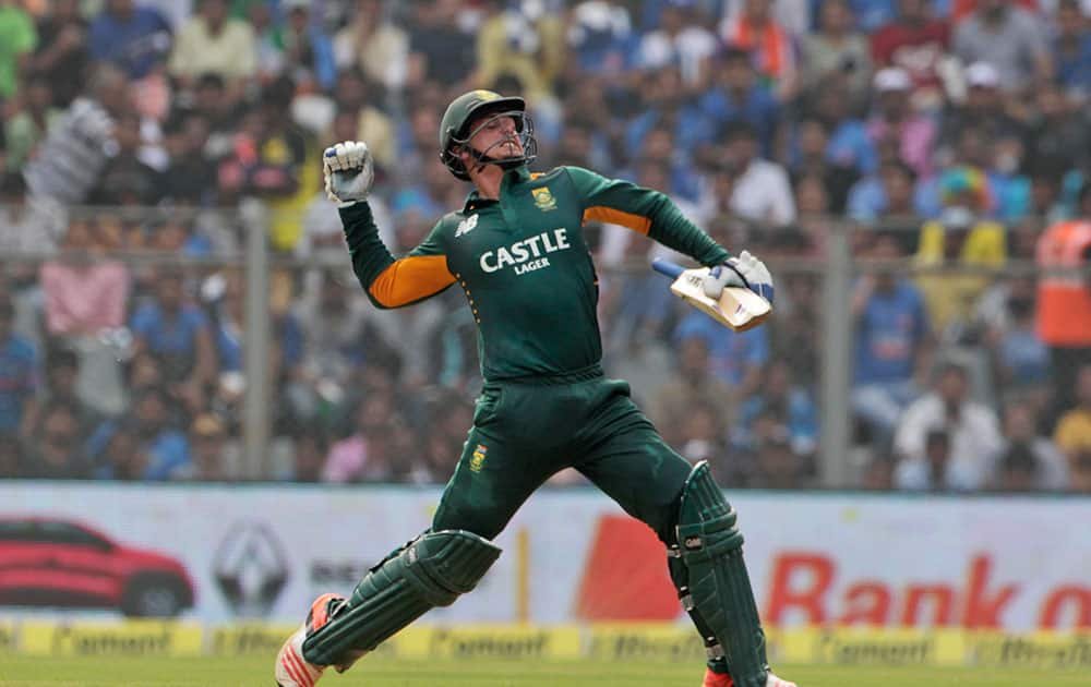 South Africa’s Quinton de Kock celebrates his hundred runs during the final one-day international cricket match of a five-game series against India in Mumbai, India.