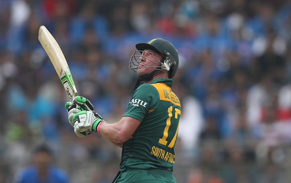 South Africa’s A.B. de Villiers hits a six during the final one-day international cricket match of a five-game series against India in Mumbai, India.